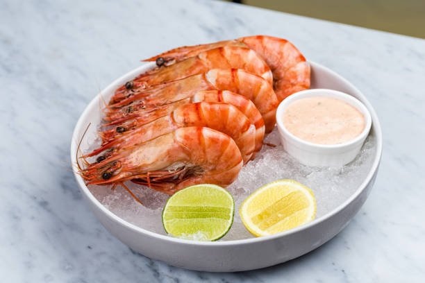 istock Fresh royal prawns with lemon and sauce 812172392