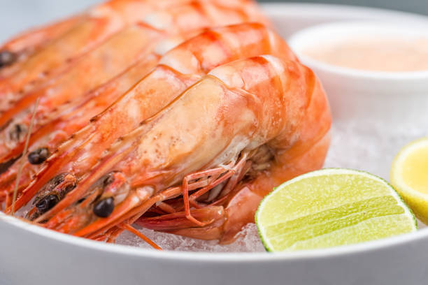 istock Fresh royal prawns with lemon and sauce 812176658