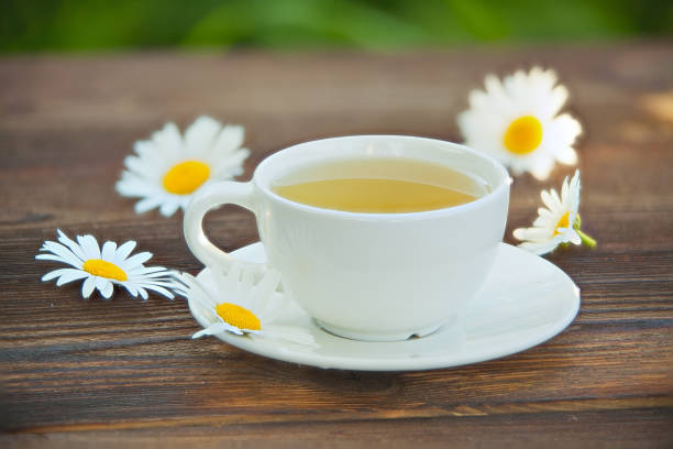 istock porcelainl cup with green tea on table 812184384