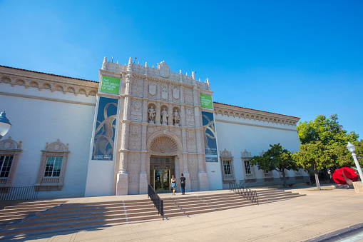 An editorial stock photo of the San Diego Museum of Art. People can be seen approaching the museum to enjoy the works of art on display.