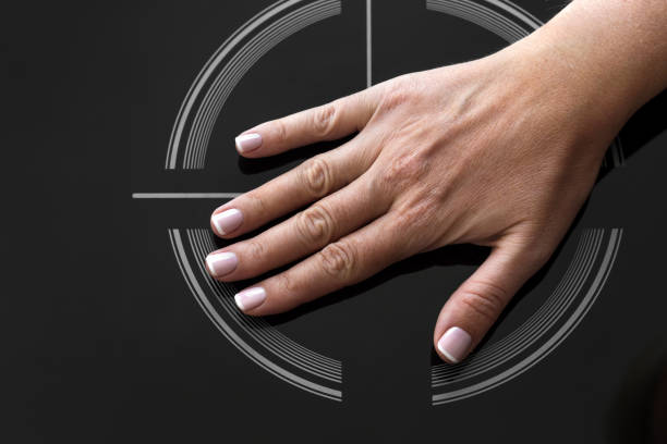 Female palm hand on on Induction stove
