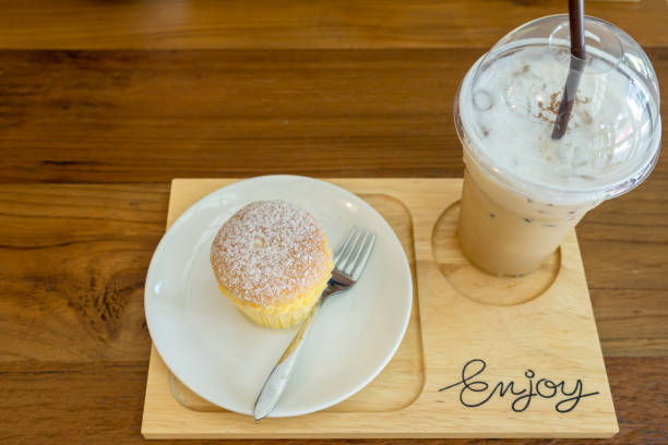 istock Ice coffee and Milk Cake on wood board 812206952