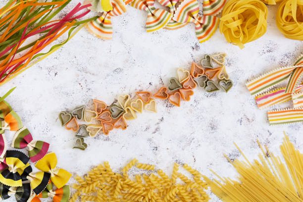 istock Dry pasta background. Different pasta on white background. Flat lay. Top view. 812215348