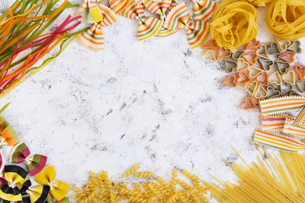 istock Dry pasta background. Different pasta on white background. Flat lay. Top view. 812215928