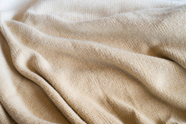 istock Soft Neutral Fabric Background Diagonal Folds 812217550