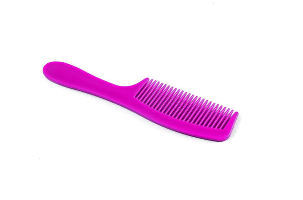 istock Purple Hair Comb on white background 812232490