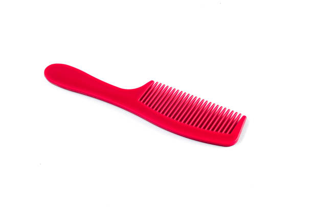 istock Red Hair Comb on white background 812236890