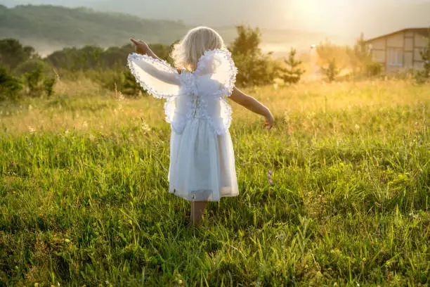 Photo of little girl outdoors summertime