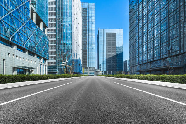 istock Clean asphalt road with city skyline background 812240086
