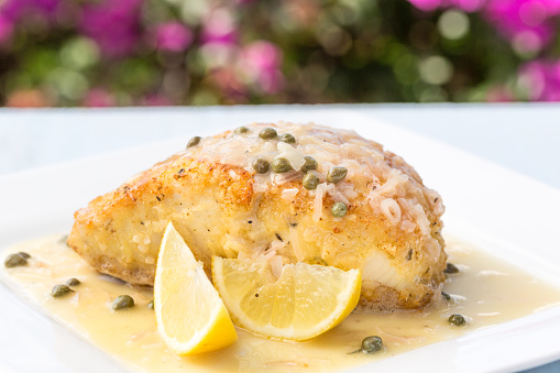 Fresh Ono, or Wahoo, sauteed in a macadamia nut crust with capers and lemon sauce