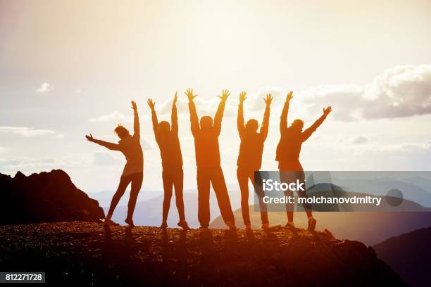 Five Happy Friends With Raised Arms Stock Photo - Download Image Now - Sports Team, Mountain Peak, Teamwork