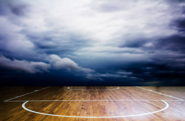 istock basketball court with storm cloud over background 812353668