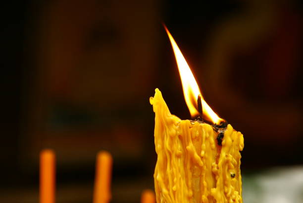 istock litting inscent with candle light in a temple 812363850