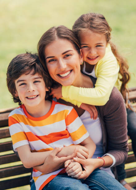 istock Mother with her children 812375976