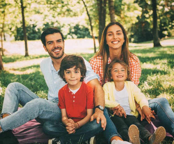 istock Young family in the park 812375992