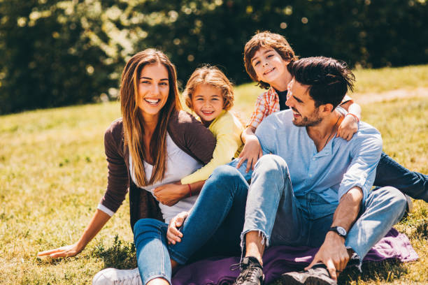 istock Young family in the park 812376010