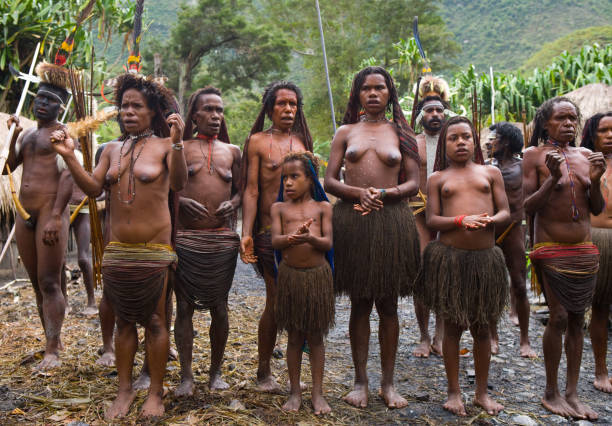 Women Dani tribe  with children. July 2009, 2012 The Baliem Valley, Indonesian, New Guinea