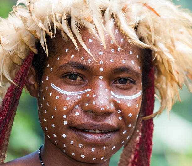 Portrait of Woman Dani tribe in ritual coloring on the body and face. stock photo