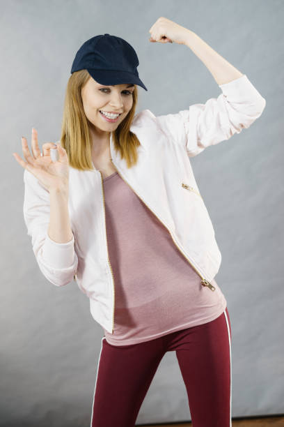 istock Young woman showing her arm muscles 812404672
