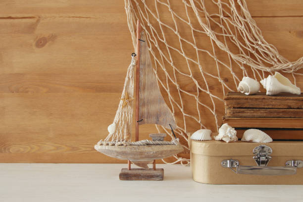 istock Nautical concept with sea life style objects on wooden table 812408186