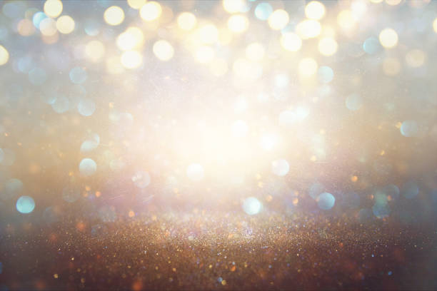 istock glitter vintage lights background. light silver and gold. defocused 812408512