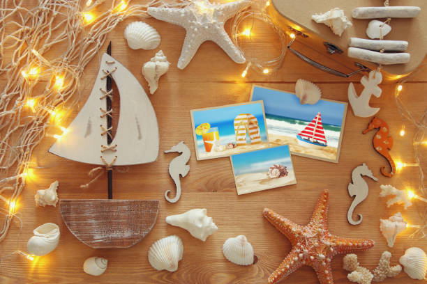 istock Nautical concept with sea life style objects on wooden table. 812408548