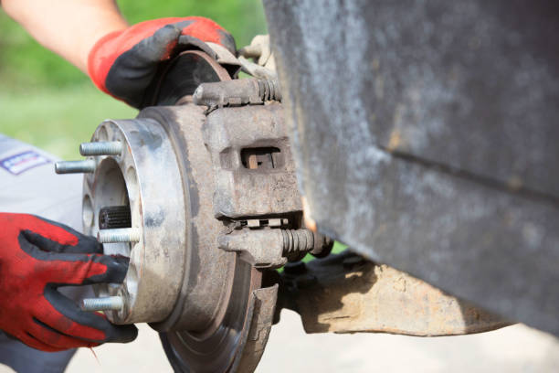 istock changing wheel for off road car 812411278