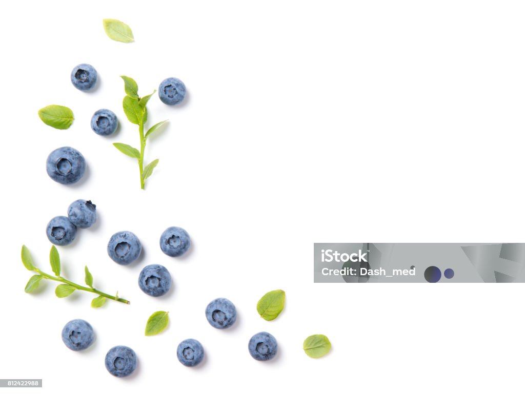 Fresh blueberries and leaves, berry ornament frame on white background, closeup, top view Fresh ripe blueberries and leaves, berry ornament frame on white background, closeup, top view Bilberry - Fruit Stock Photo