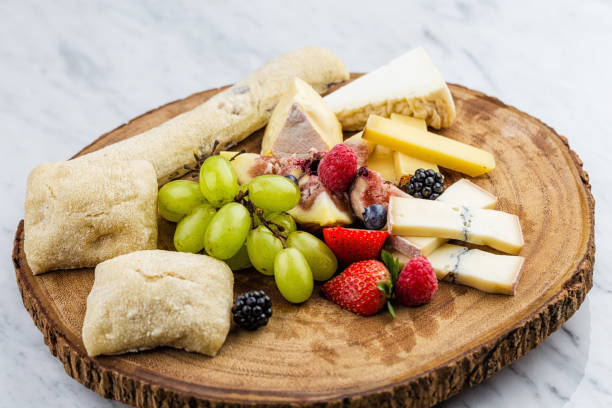 istock Cheese plate with bread grapes and strawberries 812423554