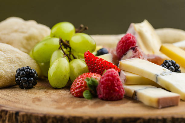 istock Cheese plate with bread grapes and strawberries 812426168
