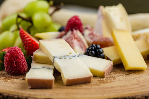 istock Cheese plate with bread grapes and strawberries 812426292