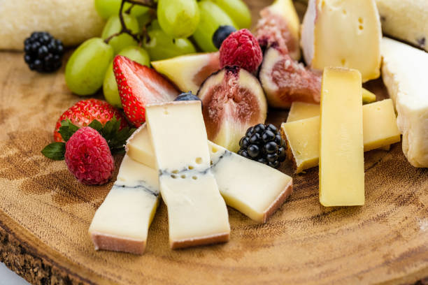 istock Cheese plate with bread grapes and strawberries 812426412