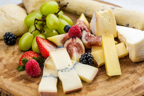 istock Cheese plate with bread grapes and strawberries 812426494