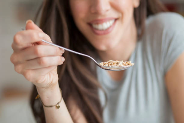 istock Woman breakfast cereals in the kitchen 812446620