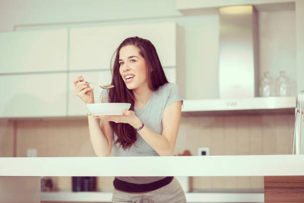 istock Woman breakfast cereals in the kitchen 812446836