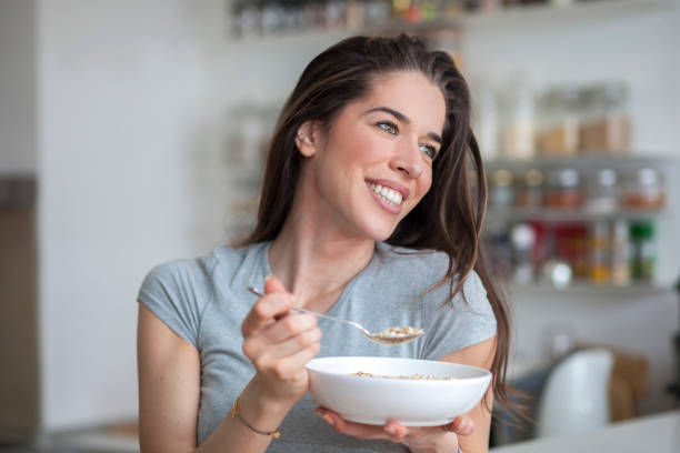 istock Woman breakfast cereals in the kitchen 812447008