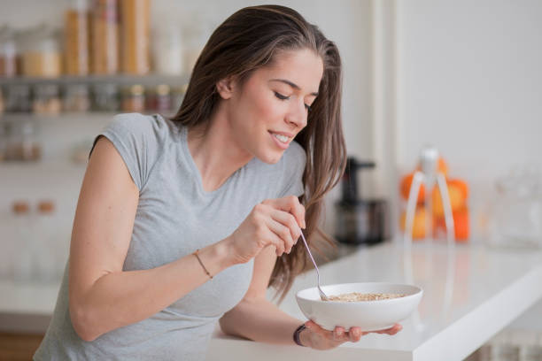 istock Woman breakfast cereals in the kitchen 812447054