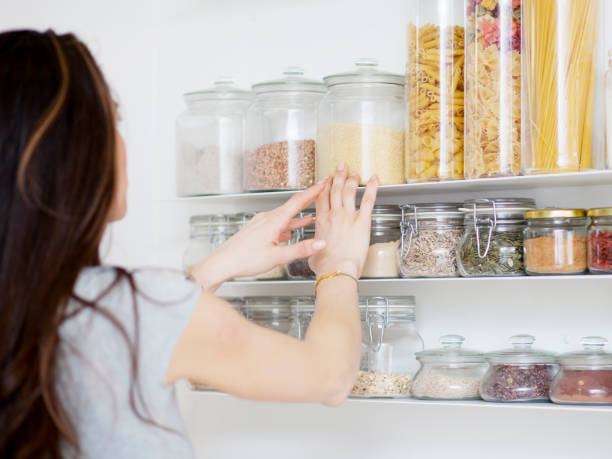 istock Beautiful young  woman breakfast cereals in the kitchen 812451622