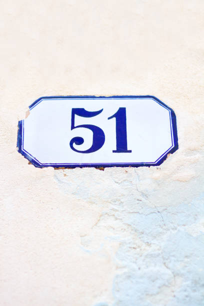 istock Number 51 Street Address Tile On Pale Pink Wall 812454872