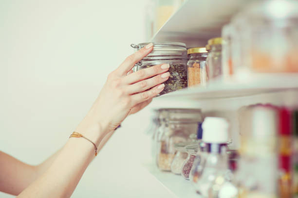 istock Young  woman breakfast cereals in the kitchen 812457100