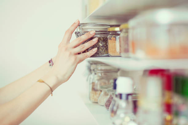 istock Young  woman breakfast cereals in the kitchen 812457146