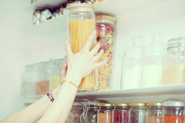istock Young  woman breakfast cereals in the kitchen 812457274