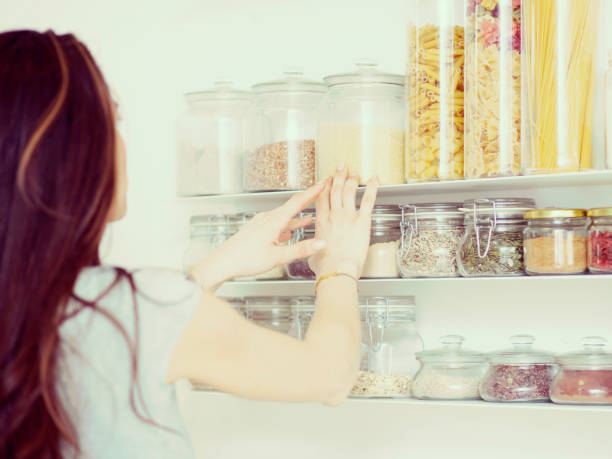 istock Young  woman breakfast cereals in the kitchen 812457302