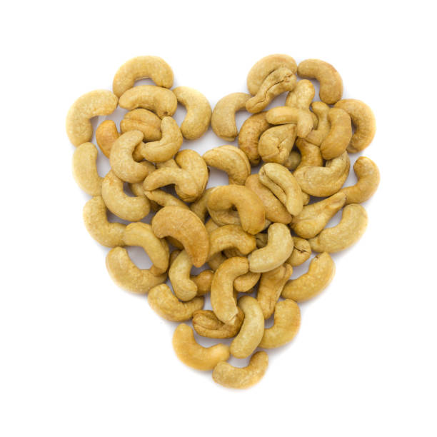 istock Heart cashew nuts isolated on white background. Concept food image love cashew nuts. 812457708