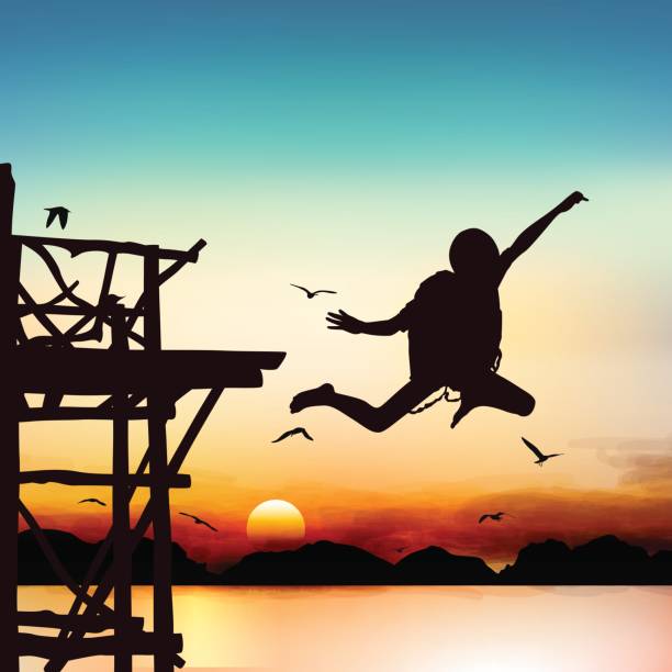 istock Silhouette and jumping boy in the twilight with blue sky. 812463236