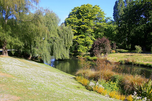 Christchurch public park before earthquake, idyllic flowerbed gardens and river creek, springtime landscape, Canterbury region, South New Zealand panorama