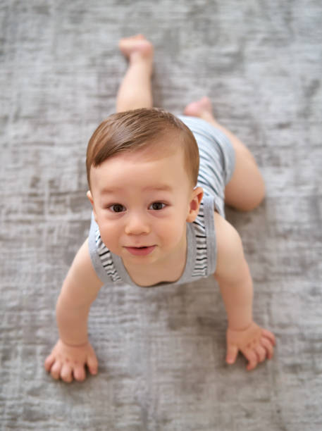 istock Cute baby is looking to camera 812463762