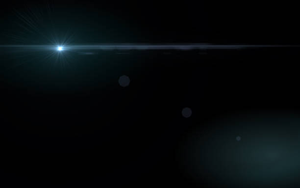 istock Abstract blue lens flare light over black background 812473126