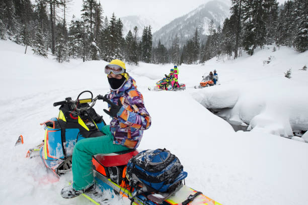 istock A snowmobile tour in snowy mountains. 812473414