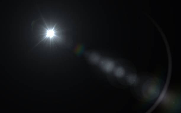 istock Abstract lens flare light over black background 812473830